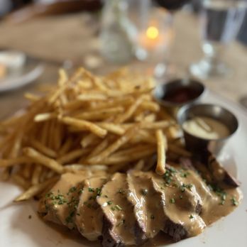 Brasserie by Niche signature dishes  Steak Frites, Onion Soup Gratinée, Escargots de Bourgogne, Mussels Marinière, Duck Confit, Profiteroles.